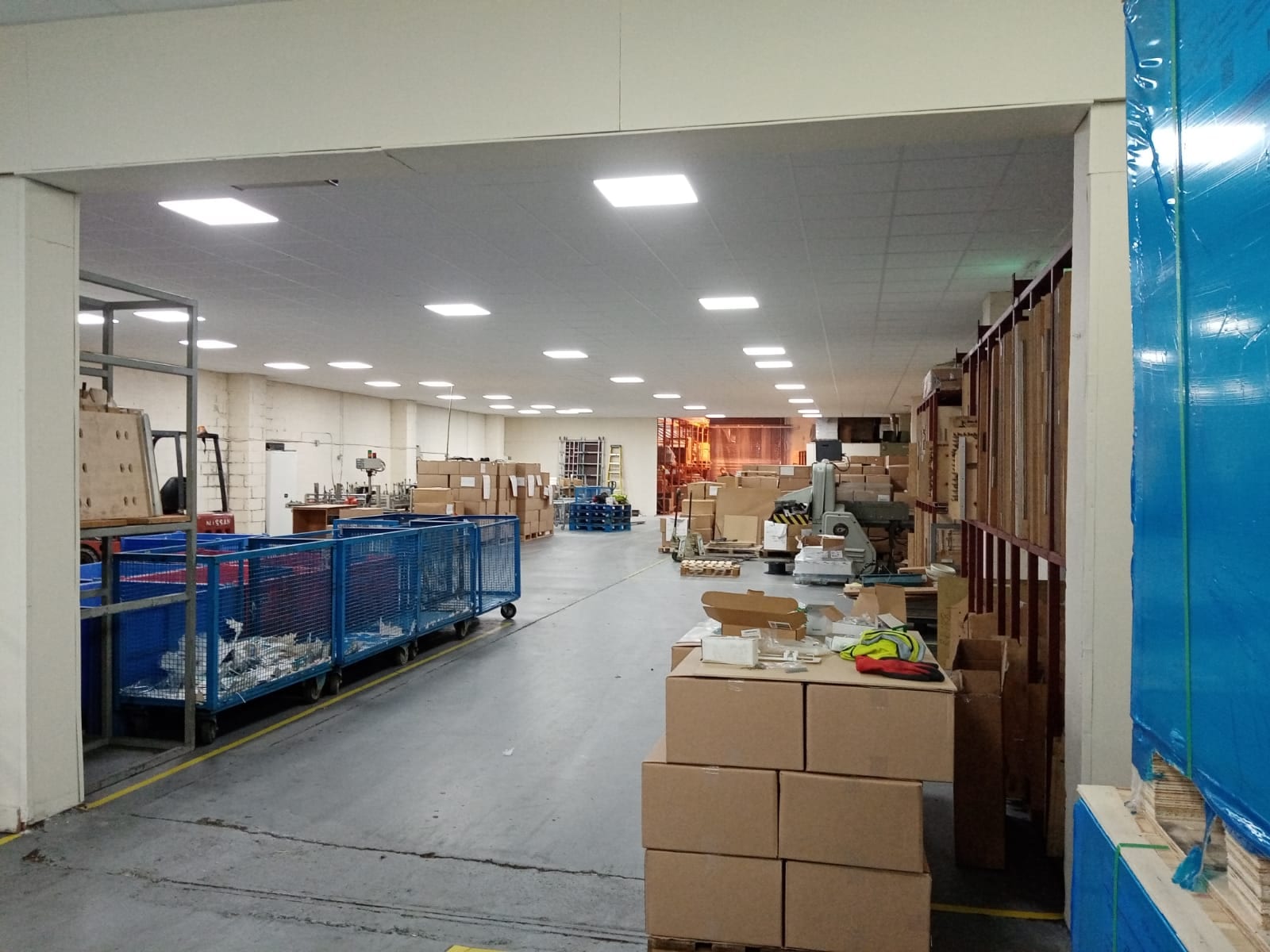 Commercial suspended ceiling grid installation concealing MEP services